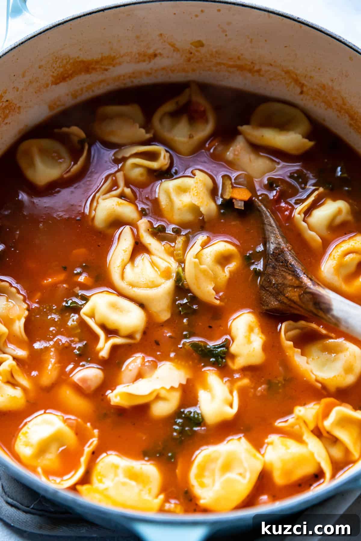 tuscan tortellini soup in a pot.